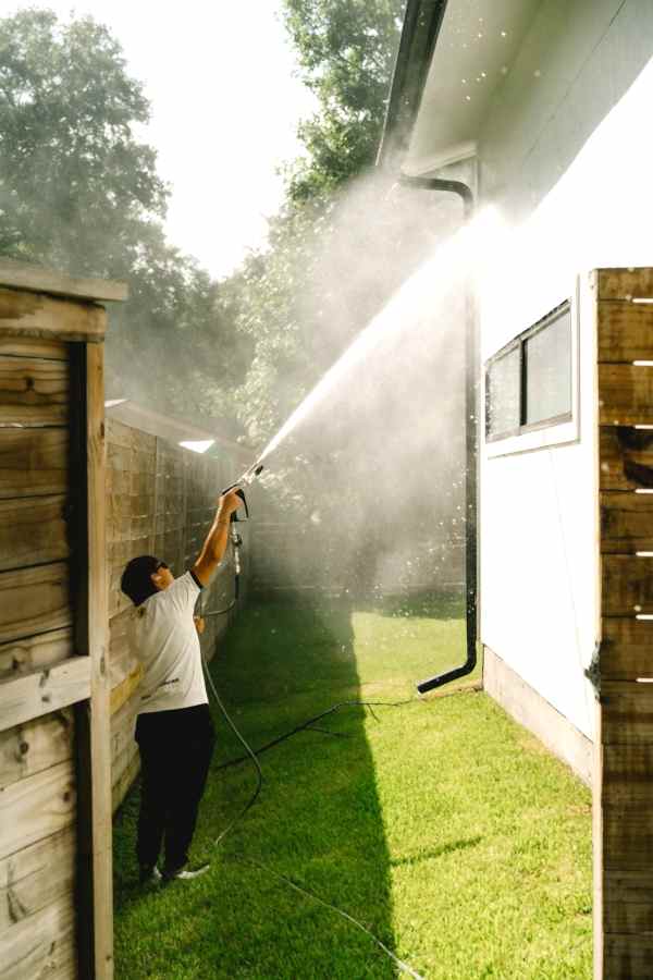 Soft washing a wood fence